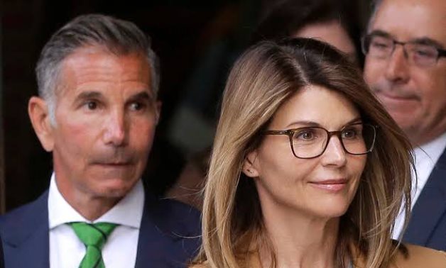  Actor Lori Loughlin, and her husband, fashion designer Mossimo Giannulli, leave the federal courthouse after facing charges in a nationwide college admissions cheating scheme,REUTERS/Brian Snyder.