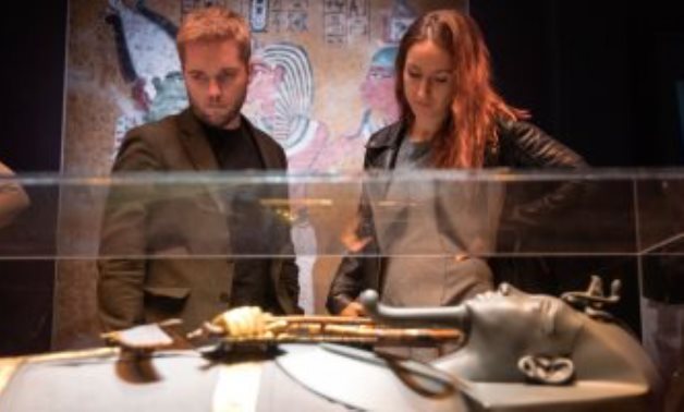 File photo: Two visitors at Tutankhamun ... Treasures of the Golden Pharaoh exhibition.
