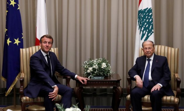 Lebanese President Michel Aoun welcomes French President Emmanuel Macron at Beirut International airport, Lebanon August 31, 2020. REUTERS/Gonzalo Fuentes/Pool