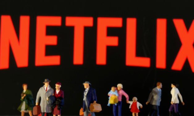 FILE PHOTO: Small toy figures are seen in front of diplayed Netflix logo in this illustration taken March 19, 2020. REUTERS/Dado Ruvic/Illustration