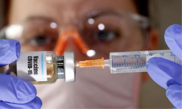An employee demonstrating vials with "Gam-COVID-Vac" vaccine against the coronavirus disease developed by RDIF- Reuters