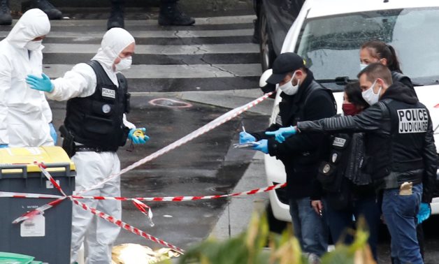 Forensic experts work at the scene of a stabbing attack near the former offices of French magazine Charlie Hebdo, in Paris, France September 25, 2020. REUTERS/Gonzalo Fuentes