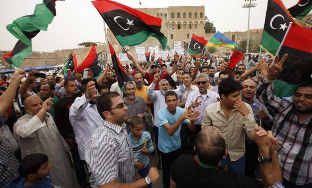 Libyans celebrate after the Supreme Court invalidated the country's parliament, at Martyrs' Square in Tripoli November 6, 2014. REUTERS/Ismail Zitouny