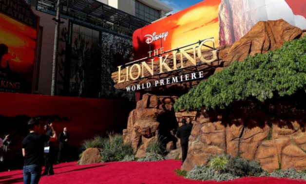 FILE PHOTO: A person takes pictures ahead of the World Premiere of "The Lion King" in Los Angeles, California, U.S., July 9, 2019. REUTERS/Mario Anzuoni