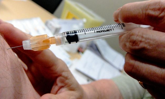 A man gets H1N1 flu vaccine – Daniel Paquet/Flickr