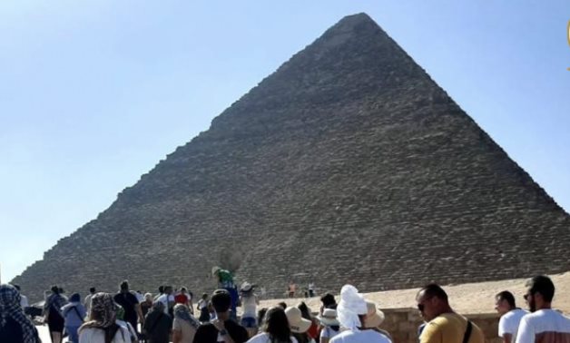Tourists visiting the Pyramids of Giza - photo via Egypt's Ministry of Tourism & Antiquities