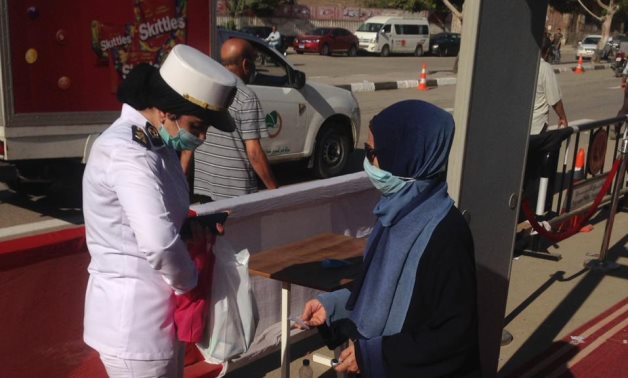 Police women have been witnessed outside polling stations across different governorates to assist in securing the voting process - ET 