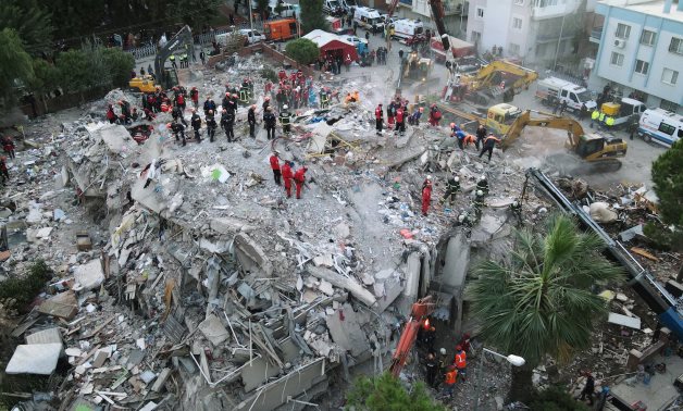An aerial view shows rescue workers searching for survivors at a collapsed building after an earthquake in the Aegean port city of Izmir, Turkey October 31, 2020. Picture taken with a drone. REUTERS/Murad Sezer