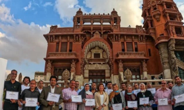 The trainees taking a memorial photo in front of the Baron Empain Palace in Heliopolis - photo via Egypt's Min. of Tourism & Antiquities