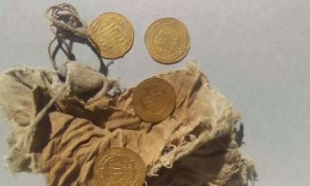 File: The newly uncovered gold dinars.