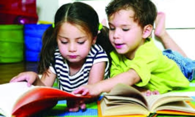 FILE - Children reading together