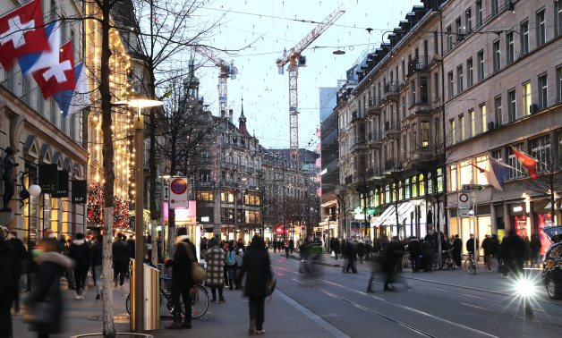 People walk under Christmas illuminations, as spread of the coronavirus disease continues, on Bahnhofstrasse shopping street in Zurich, Switzerland November 28, 2020. Picture taken with long exposure. REUTERS