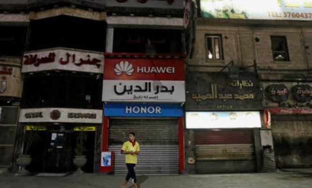 A man walks in front of closed shops in Cairo. (File photo: Reuters)
