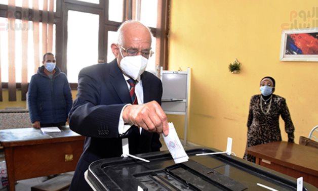 Egyptian Parliament's Speaker Ali Abdel al-Aaal casting his vote in the run-off phase of the second round of parliamentary election.