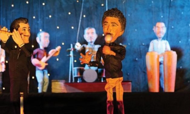 Mohammed Mounir and his band in a puppet performance - ET