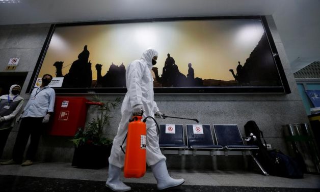 A worker sprays disinfectant at Hurghada International Airport in Egypt, June 18, 2020 – Reuters 