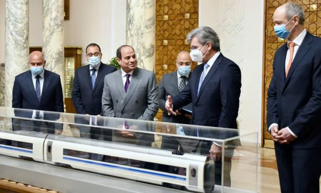 FILE - Sisi meets with Siemens CEO Joe Kaeser where they reviewed the final agreement on the establishment of the electric train system.- Presidency