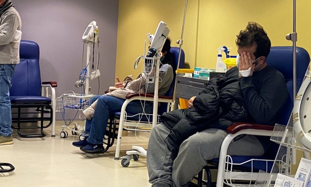 Patients sit at the waiting room in Saint George Hospital University Medical center, in Beirut, Lebanon January 15, 2021. Picture taken January 15, 2021. REUTERS/Ayat Basma