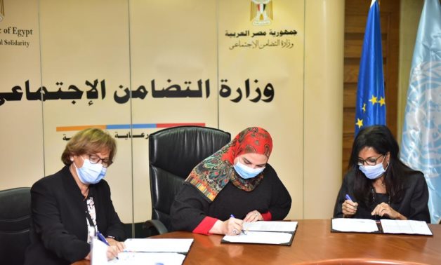 Minister of Social Solidarity Nevine al-Qabaj (middle) and representatives of the EU and UNDP sign the COVID-19 Response Support Project on January 21, 2021. Press Photo 