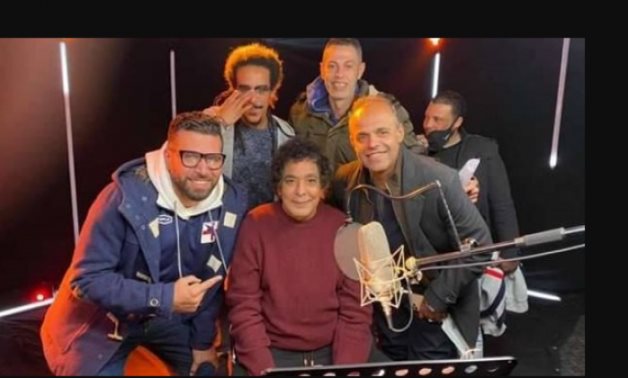 File: Mohamed Mounir along with the song crew.