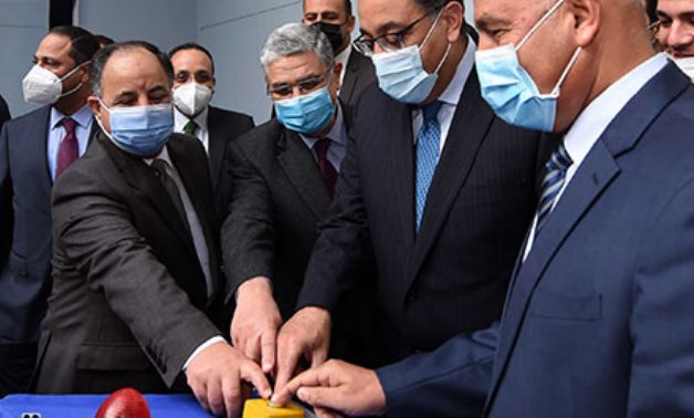 Prime Minister Mostafa Madbouly and Transport Minister Kamel al-Wazir push the button to start the tunnel-boring machine - Youm7