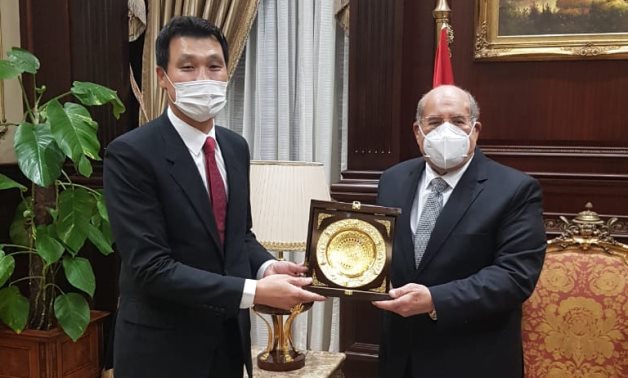South Korean ambassador to Egypt Hong Jin-Wook and Speaker of the Egyptian Senate Abdel-Wahab Abdel-Razeq pose for a photo- press photo