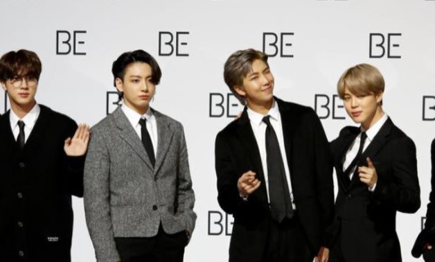 FILE PHOTO: Members of K-pop boy band BTS pose for photographs during a news conference promoting their new album "BE(Deluxe Edition)" in Seoul, South Korea, November 20, 2020. REUTERS/Heo Ran