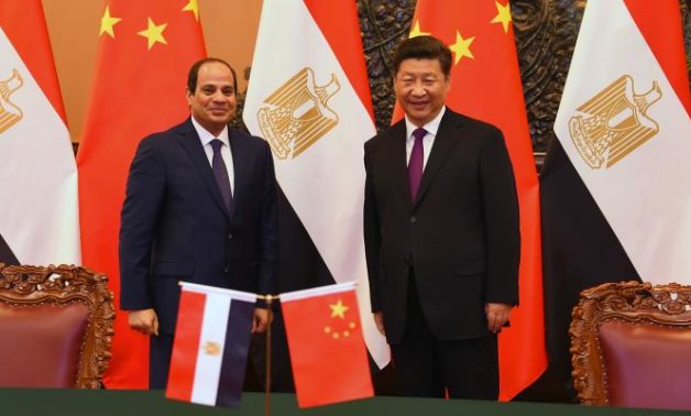 FILE - Egyptian President Abdel Fattah El Sisi (L) meets with his Chinese counterpart (R), President Xi Jinping - press photo