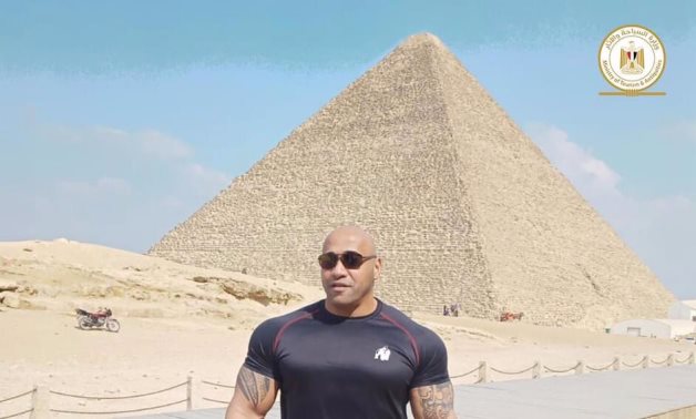 File: The coach of Egyptian Champion “Big Ramy” Dennis James visits Pyramids Antiquities area.