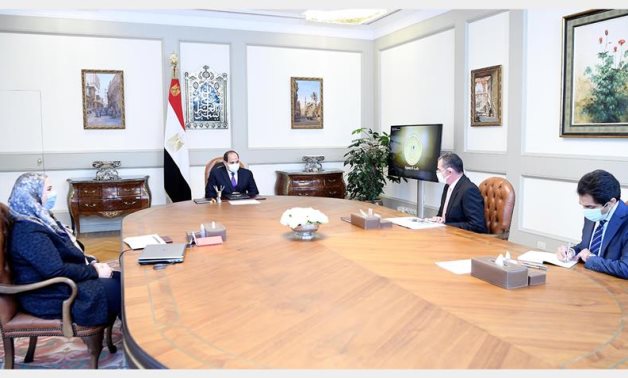 Egyptian President Abdel Fattah El Sisi meets with Minister of Social Solidarity Nevin El-Qabbaj and the president’s advisor for financial affairs, Mohamed Amin- Presidency
