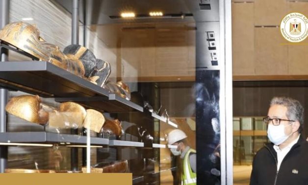 File: Egypt’s Minister of Tourism and Antiquities Khaled El Enany witnessed the placement of the first pieces of the treasures of King Tutankhamun in thei display vitrines in the Grand Egyptian Museum.