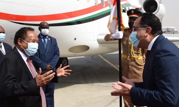 Egyptian Prime Minister Moustafa Madbouli receives his Sudanese counterpart Abdalla Hamdok who paid Egypt an official visit on Thursday- press photo