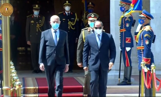  Tunisian President Kais Saeid (L) received by President Abdel Fatah al-Sisi (R) during his visit to Cairo