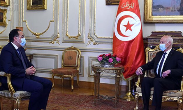 Egypt's Prime Minister Mostafa Madbouli (L) meets with Tunisian President Kais Saied - Photo handed by Youm7