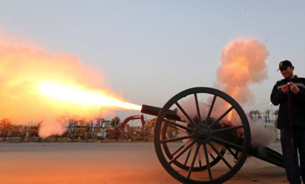 An Egyptian policeman in Cairo fires a cannon to announce the time to break fast during Ramadan. (REUTERS file photo)
