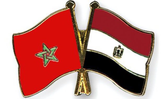 FILE - Egyptian and Moroccan Flags 