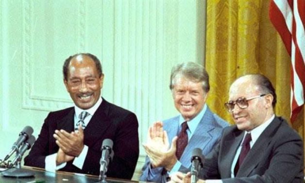 FILE - Late Egyptian President Anwar el-Sadat [Left], former US President Jimmy Carter [Middle] and former Israeli PM Menachem Begin
