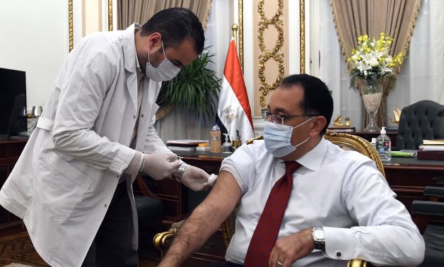 Prime Minister Mostafa Madbouli getting vaccinated on April 26, 2021. Press Photo 