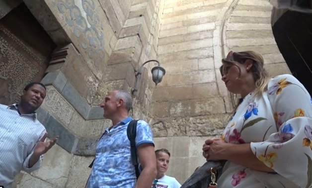Liechtenstein's Prime Minister Adrian Hasler listens to an Egyptian guide at a historic mosque in Cairo - Still image of Haggagovic video
