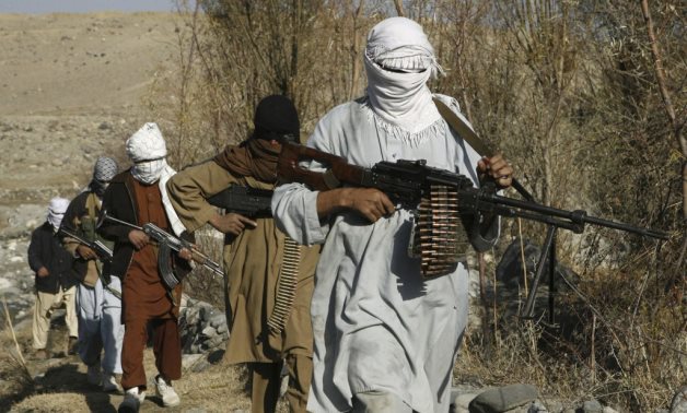 FILE - Taliban fighters pose with weapons in an undisclosed location in Nangarhar province in this December 13, 2010 picture. REUTERS/Stringer