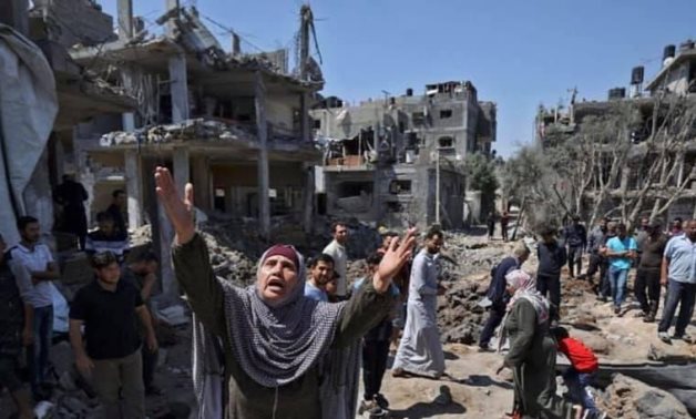 FILE - Buildings destroyed by Israeli strikes against Gaza Strip on May 13, 2021. Palestine News and Information Agency (WAFA) 