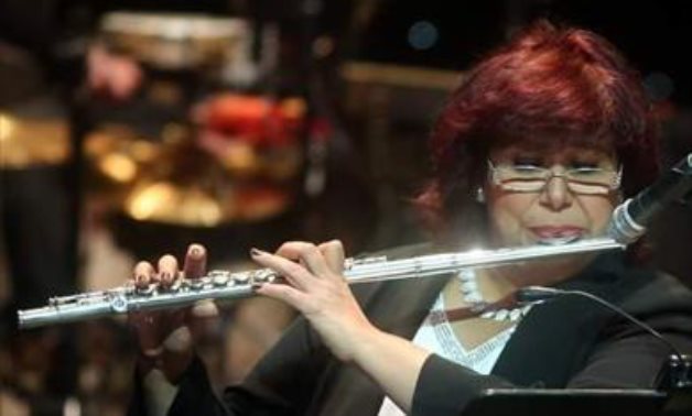 Egypt's Minister of Culture Inas Abdel Dayem playing the flute - ET