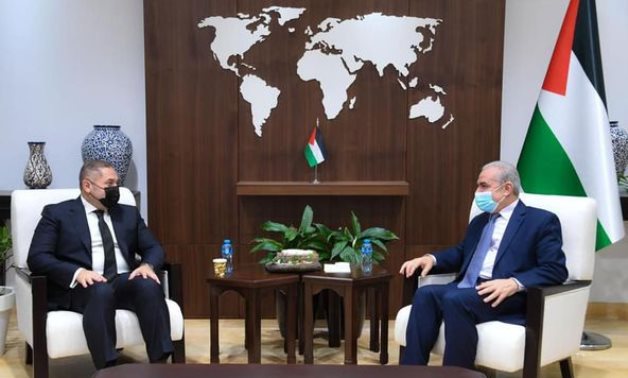 Egyptian Ambassador to Ramallah Tarek Tayel (l) and Palestinian Prime Minister Mohamed Ashteya (r) in Ramallah, West Bank on May 16, 2021. Press Photo 