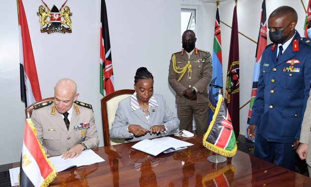Chief of Staff Mohamed Farid and Kenyan Defense Minister Monica Juma signing a technical cooperation agreement in May 2021. Press Photo 
