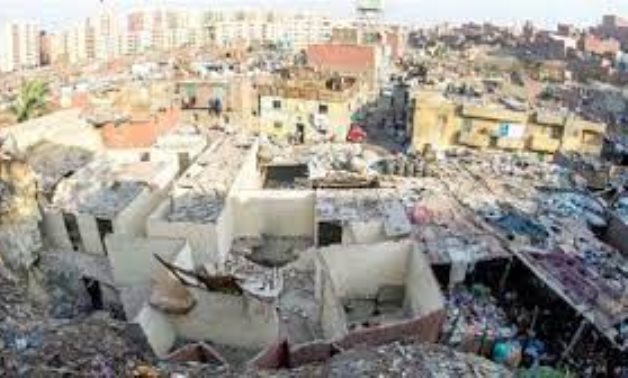 FILE - Batn Al Baqara slum area 