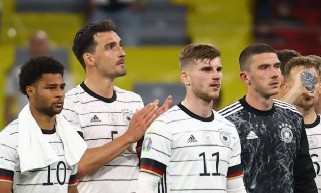 Germany's Serge Gnabry, Mats Hummels and Timo Werner look dejected after the match against France, REUTERS/Kai Pfaffenbach