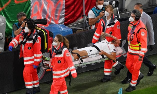 Spinazzola is stretchered off after sustaining an injury during their Euro 2020 quarterfinal clash against Belgium in Munich. Reuters