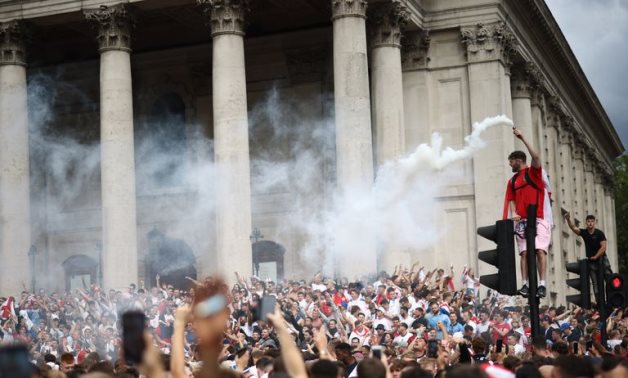 England fans with flares gather in Trafalgar Square ahead of the match REUTERS/Henry Nicholls