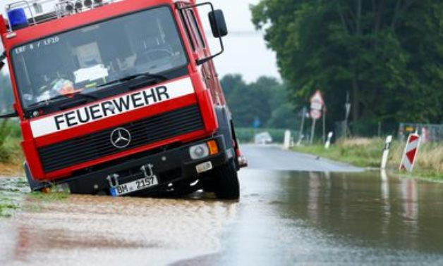 A fire truck is stuck on a flooded street following heavy rainfalls in Erftstadt, Germany, July 16, 2021. REUTERS/Thilo Schmuelgen