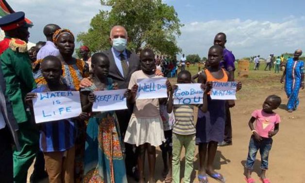 FILE - Minister of Irrigation and Water Resources Mohamed Abdel Aty posing with children while inaugurating an underground water treatment plant built by Egypt in South Sudan on June 23, 2021. Press Photo